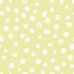 Seamless pattern with abstract dots on a yellow background.
