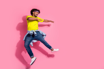 Photo of crazy good mood man wear trendy yellow clothes have fun look empty space isolated on pink...