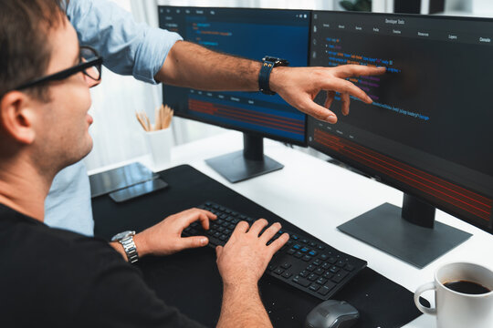 IT developers creating online software development information on screen laptop with coding program in data of application and website. Technical engineer coder on safety program concept. Sellable.