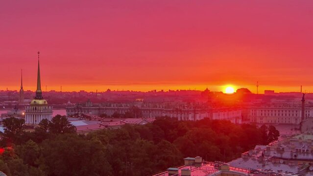 Sunrise timelapse with rain over St. Petersburg's historic center from St. Isaac's Cathedral colonnade. Admiralty Building, Palace Square, Winter Palace, Peter and Paul Fortress stand in the distance