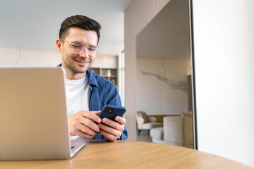 An urbane man smiles at his smartphone, balancing work and communication in a serene, minimalist...