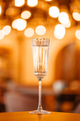 glass of prosecco or champagne light bokeh,holiday party concept
