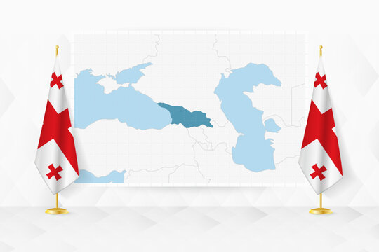 Map of Georgia and flags of Georgia on flag stand.
