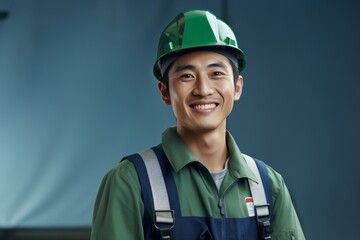 Smiley electronic engineer in green safety outfits and helmet stands in front of solar cell or  photovoltaic cell panels, half length portrait outdoor shorts. Generative AI.