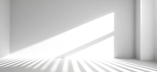 Bright, white room with natural sunlight. Linear shadows dance across floor and empty wall with copy space, creating play of contrasts and geometry, serenity and calmness, purity and simplicity