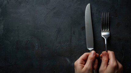 Hands reach for polished fork and knife, signaling the start of a culinary adventure. - obrazy, fototapety, plakaty