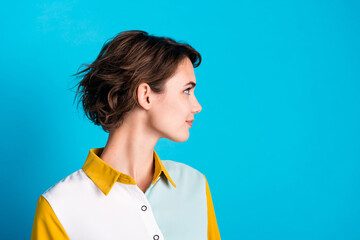 Side profile photo of confident bob brown hair lady looking empty space showing her new haircut isolated on blue color background - obrazy, fototapety, plakaty