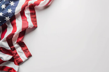 A fragment of the US flag on a white surface with copyspace for text. Background for design.
