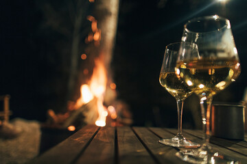 Glasses of wine at fireplace
