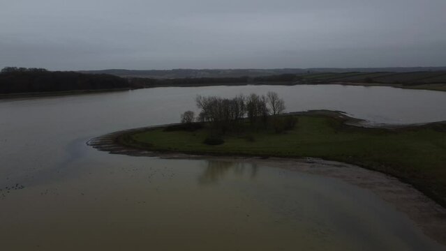 Aerial video on a winter's day over Eye Brook Reservoir, UK