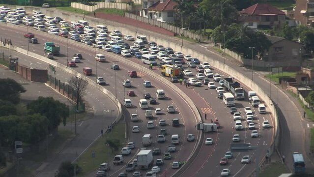 Gridlock on Durban's N3 freeway following a traffic accident, resulting in a long line of vehicles backed up.