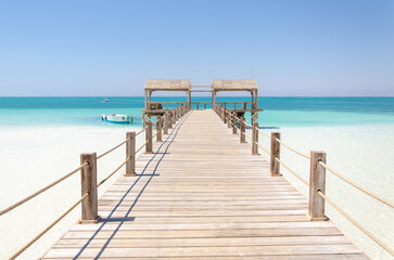 Wooden pier in Giftun island, Hurghada, Red Sea, Egypt. Vacation and Holiday concept.