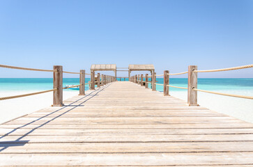 Wooden pier in Giftun island, Hurghada, Red Sea, Egypt. Vacation and Holiday concept.