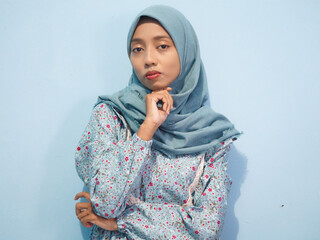 portrait of Beautiful Asian woman in blue dress and hijab. isolated on white background