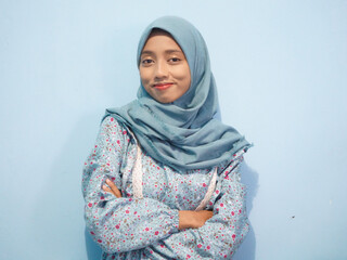 portrait of Beautiful Asian woman in blue dress and hijab. isolated on white background