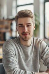 Obraz premium A man in the office. He is dressed in casual clothes. 