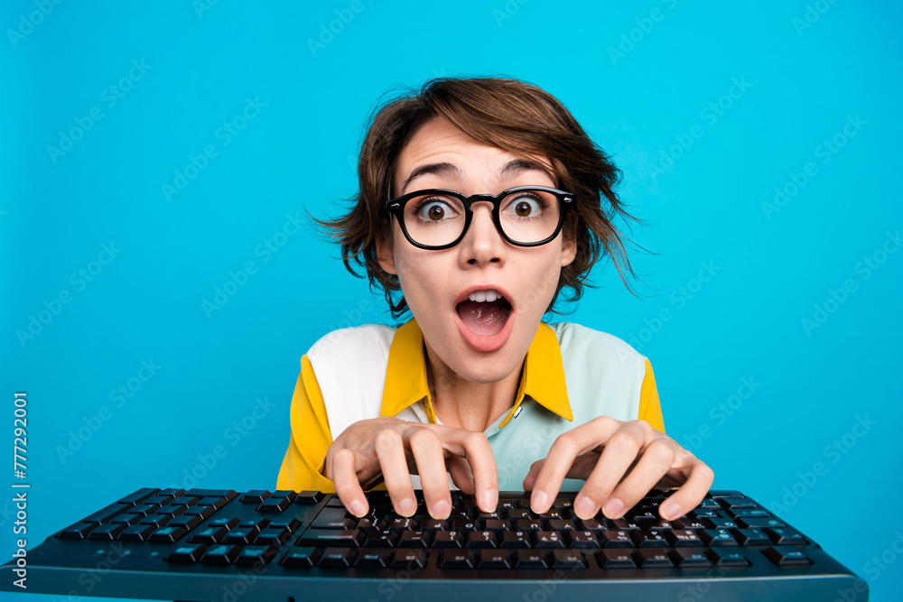 Poster photo of surprised marketer lady working on pc computer impressed writing html code isolated blue co