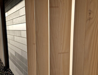 blinds of the building made of massive boards glued together. tile facing on the sunny side
