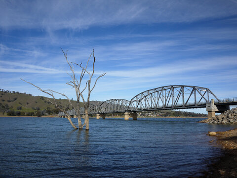Heritage listed Bethanga Bridge over water, it is a steel truss road bridge that carries the Riverina Highway across Lake Hume, an artificial lake on the Murray River in Australia.