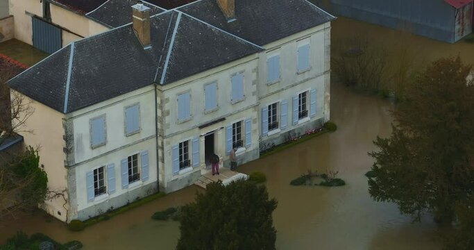 Natural disaster in Burgundy, France. Water flooded a city in the Yonne department. Aerial view of the floods in the center of France. Yonne river in flood in Chablis town. Spring flood 2024