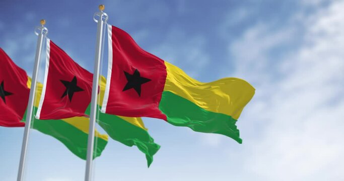 National flags of Guinea-Bissau waving in the wind on a clear day