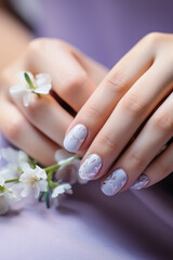 Obraz na płótnie Canvas Elegant Hand with Floral Nail Art Holding Cherry Blossoms