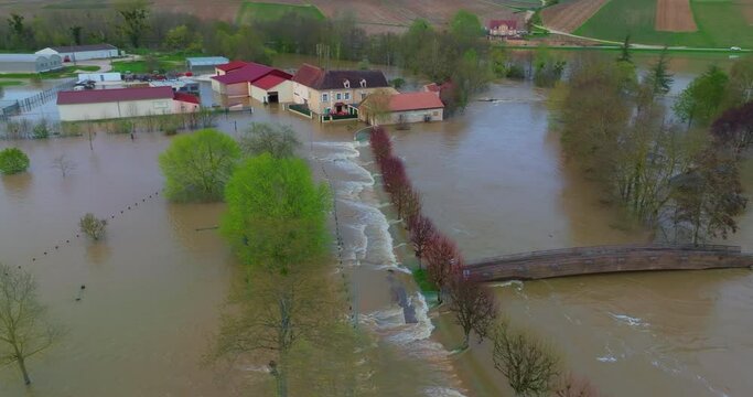 Natural disaster in Burgundy, France. Water flooded a city in the Yonne department. Aerial view of the floods in the center of France. Yonne river in flood in Chablis town. Spring flood 2024