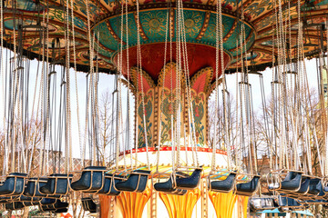 Carousel in an amusement park on a sunny day.