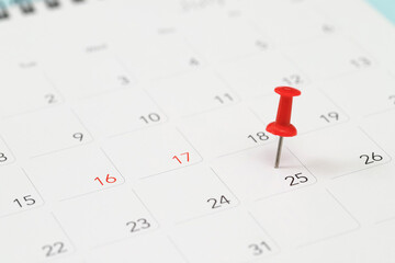 mark the event day with a pin. Thumbtack in calendar concept for busy timeline organize...
