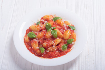Italian homemade potatoes gnocchi with tomatoes sauce