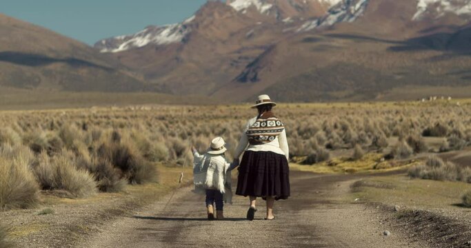 Bolivian grandMother and Son Walking