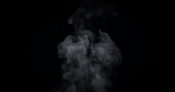 White natural rising steam from food or hot drink isolated on a black background. Сan be used in any projects with hot food. Slow motion, 4K