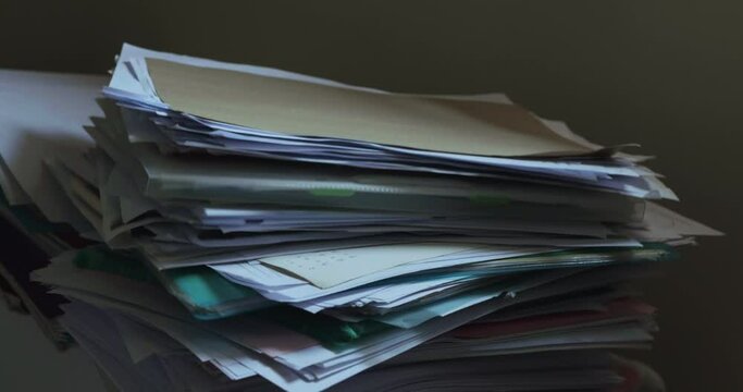 Large pile of papers dropped on floor, Too much work
