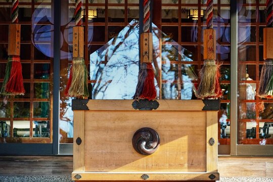 Shinto shrine with saisenbako and suzu