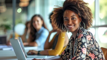 Portrait of young stylist designer African American female businesswomen looking camera sitting in meeting room running business startup, modern home office laptop computer or co-working space