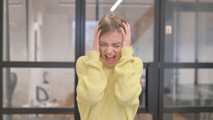 Portrait of Angry Blonde Young Woman Screaming in Anger