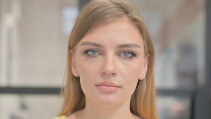 Close up of Serious Face of Blonde Young Woman