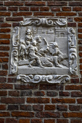 Relief on a wall in Le Beguinage, Leuwen, Belgium. Station of the Cross