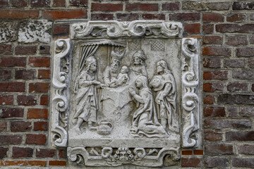 Christian relief on a wall in Le Beguinage, Leuwen, Belgium. Jesusâ€™s circumcision