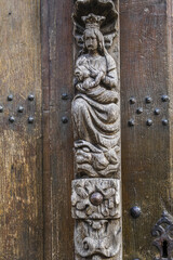 St John de Doperkerk church in the large beguinage of Louvain/Leuven, Belgium. Door reliefs. Virgin and child