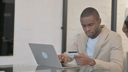 African American Man Enjoying Online Shopping