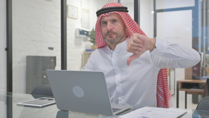 Middle Aged Muslim Man Doing Thumbs Down in Camera with Both Hands