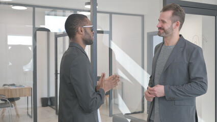 Fototapeta premium Hand Shake by Multi Ethnic People in Office
