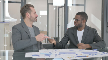 African Man Giving Money and Shaking Hand