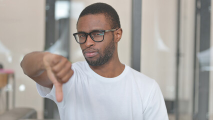 Portrait of Casual African Man with Thumbs Down