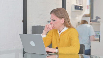 Coughing Blonde Casual Woman Using Laptop in Office