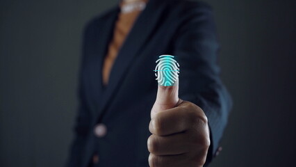 Service users lift their thumbs up and scan their fingers to enter the identity verification system. There is a fingerprint scanning light icon. Security concept for accessing technology systems.