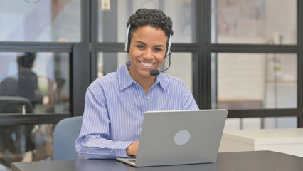 Call Center Mixed Race Woman Smiling at Camera
