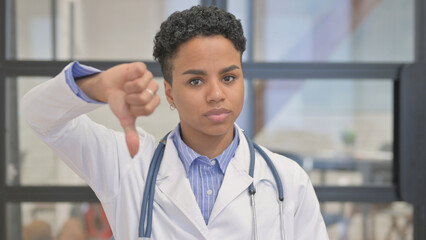 Portrait of African Female Doctor with Thumbs Down