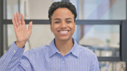 Portrait of African Woman Waving Hand to Say Hello